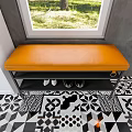 White Shoe Cabinet with Bench and Shoes in Modern Room with Window and Green Plant
