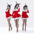 Women in Red Christmas Dresses with Reindeer Antlers Stockings and High Heels on White Background