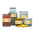 Mama's Pantry Glass Jars Filled With Various Colorful Foods And Yellow Round Snacks