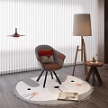 Gray Accent Chair With Red Cushion On Cat Face Pattern Round Rug And Floor Lamp