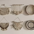 Handmade Woven Wall Decor with Macramé Hangings and Woven Plates on White Wall