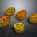 Fresh Kiwano Fruits Whole and Halved with Spiky Exterior and Green Flesh on Dark Background
