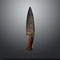 Ancient Textured Stone Spearhead Weapon with Sharp Pointed Blade and Wooden Handle Wrapped in Cord