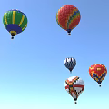 Colorful Hot Air Balloons As Amusement Rides Flying In Clear Blue Sky