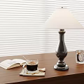 Wooden Table With Open Book Coffee Cup Table Lamp And Window Blinds