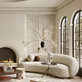 Elegant Cream Tone Living Room Interior With Soft Curved Sofa Cozy Fireplace And Arched Windows