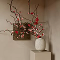 White Textured Vase With Red And Pink Flower Branches On Cube Stand Against Beige Wall