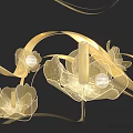 Golden Petal Art Installation With Illuminated Design Flowing Ribbons And Perfume Bottle Center