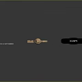Set of Three Different Keys Including Blue Golden and Black Handled on Dark Surface