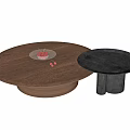 Round Walnut Wood Coffee Table And Black Side Table With Red Fruit Plate