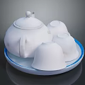 White Ceramic Teapot With Three Cups On Blue Rimmed Tray For Daily Use