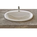 White Oval Washbasin With Chrome Faucet On Gray Stone Countertop Surface