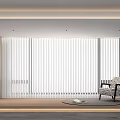 White Vertical Blinds In Modern Living Room With Beige Flooring Accent Chair And Wooden Bookshelf