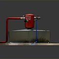 Red Industrial Valve Device On Gray Concrete Base With Red Pipes And Fittings