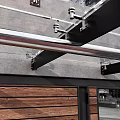 Modern Wooden Entrance Door With Glass Panel And Glass Canopy Over Concrete Wall Front Steps