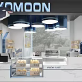 YOMOON Cafe Interior With Blue White Decor Hanging Lights Fresh Bread And Moon Juice Counter