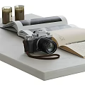 Vintage Camera With Open Book And Notebook Displayed On Tabletop Surface 3d model