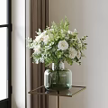 Green Glass Vase With White Flowers And Green Leaves On Small Table