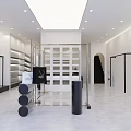 Modern Beauty Salon Interior Open Layout Black Sofa Glass Clothing Racks White Walls Gray Floors