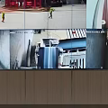 Modern Monitoring Room Featuring Large Screen Surveillance Feeds Control Desk Monitors And Chairs