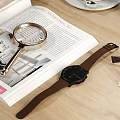 Elegant Decorative Ornament Combination on Wooden Table with Vase Coffee Cup Lamp Magazine and Watch