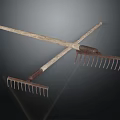 Two Crossed Vintage Garden Rakes with Wooden Handles and Metal Tines as Decorative Accents