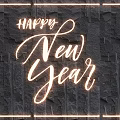 Festive Lighting Combination With Happy New Year Text And Glowing Frame On Dark Stone Wall