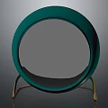 Green Circular Decorative Mirror With Gold Metal Stand And Reflective Surface