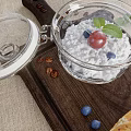 Homemade Yogurt with Berries Mint Leaves and Lime on Wooden Tray Coffee Beans Toasted Bread