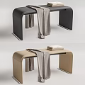 Black and Beige Leather Ottomans with Gray Blanket and Stack of Books