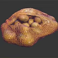 Fresh Potatoes in Mesh Bag on Black Background