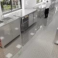 Spacious Commercial Kitchen Interior With Stainless Steel Workstations And Bright Lighting