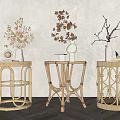 Elegant Rattan Side Tables With Decorative Vases And Green Plants