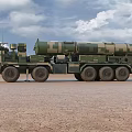 Camouflage Green Military Vehicle With Missile Launch System And Multiple Wheels On Desert Terrain
