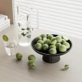 Fresh Green Limes in Black Bowl with Glass Pitcher and Mint Leaves on Wooden Table
