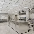 Commercial Kitchen Interior Design With Stainless Steel Worktables Cabinets Ovens And Vent Hood