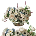 Elegant Floral Arrangement With White And Blue Flowers In Glass Vase
