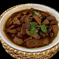 Tasty Braised Meat Stew With Chunks In Broth Topped With Fresh Coriander In Bamboo Bowl