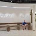 Modern Coffee Shop Store Front Desk With Glass Facade And Signage