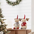Cozy Recreation Room Interior With Decorated Christmas Tree Wreath Reindeer Figurines And Plush Chair