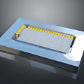 Industrial Equipment With Gray Panel And Yellow Components On Silver Base