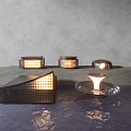 Modern Outdoor Lights With Geometric Metal Frames Glass Bases And Warm Light By Water