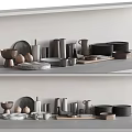 Assorted Kitchenware Display With Metal Marble Bowls Plates Cups On Neutral Countertop