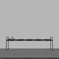 Modern Black Metal Shelf with Circular Trays Against White Wall and Gray Carpet