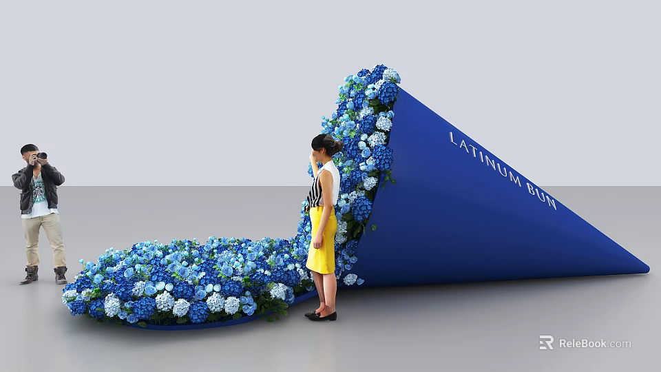 Woman Standing By Latrobe Blue Structure With Blue And White Flowers 3d model 