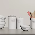 Neatly Arranged White Kitchen Utensils With Bowls Canisters And Spatulas On White Background