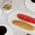 Delicious Raspberry Eclair And Striped Pastry With Coffee And Sugar Cubes On Table