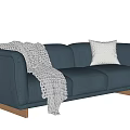 Navy Blue Three Seater Sofa With White Knitted Blanket And Wooden Legs