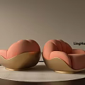 Elegant Modern Single Sofa With Coral Upholstery And Golden Base On Round Rug