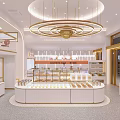 Elegant Dessert Shop Interior With Circular Pastry Display Counter Golden Chandeliers And White Shelves